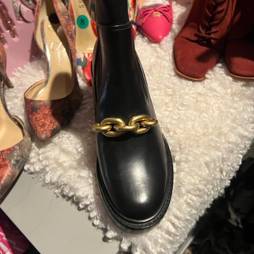 Black coach boots size 8.5 
Never worn